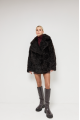 Double-sided curly sheepskin coat in dark chocolate color made of natural sheepskin in OVERSIZE style